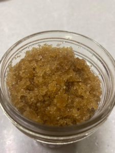 Close up of body scrub in mason jar